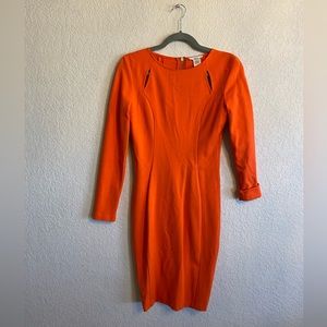Orange long sleeve dress with cut outs